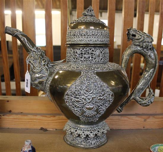 A Tibetan bronze and paktong teapot and cover, late 19th / early 20th century, 36cm